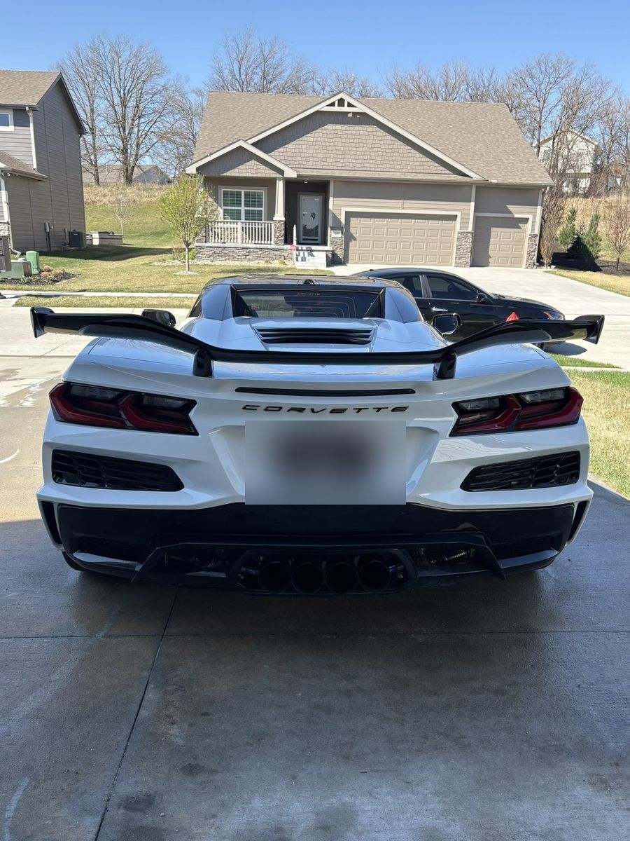 Rear of Corvette Z06 showing QUIET license plate and quad exhaust