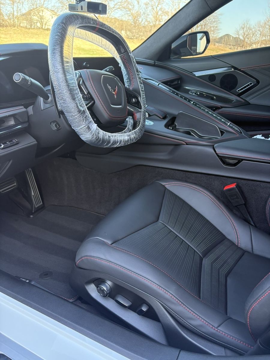 Black leather Z06 interior with red stitching after detailing
