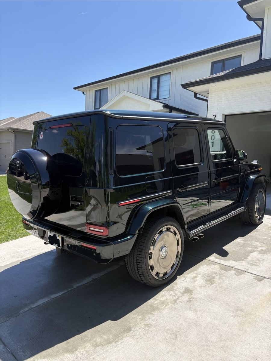 Rear 3/4 view of clean green G63 AMG G-Wagon
