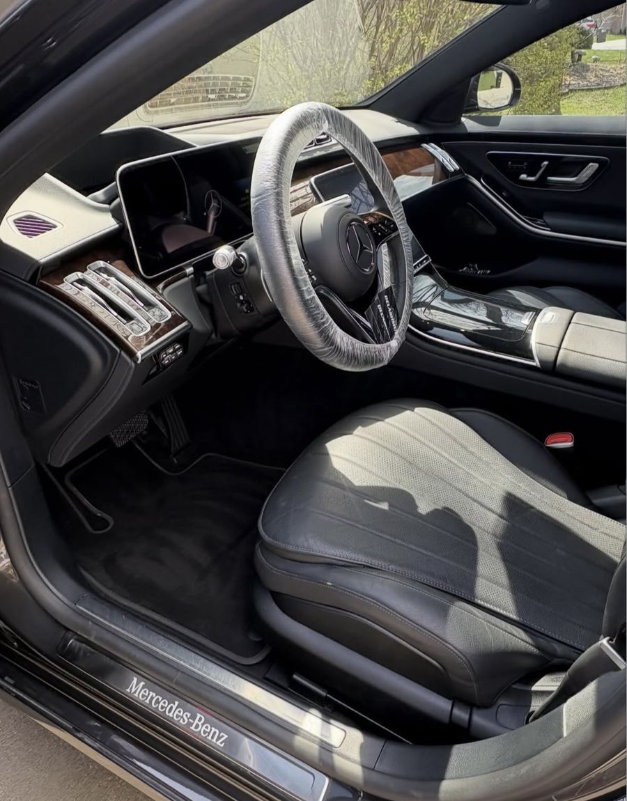 Clean front view of Mercedes S580 in driveway